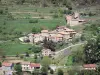 Eyrieux valley - Houses surrounded by meadows overlooking River Eyrieux; in the town of Chalencon in the Regional Natural Park of the Ardèche Mountains