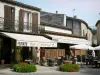 Fourcès - Café terrace and houses of the bastide fortified town