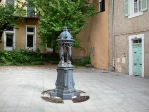 Gap - Small fountain and facades of houses in the old town