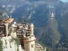 Gourdon - View of the terrace of a restaurant and of surrounding mountains