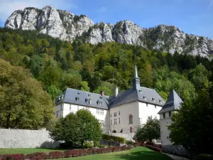 Grande Chartreuse monastery - Correrie of the Grande Chartreuse: monastic buildings housing the museum of the Grande Chartreuse, Saint-Sauveur chapel, garden, trees and rock walls of the Chartreuse mountains (Chartreuse Regional Nature Park) dominating the whole (in the town of Saint-Pierre-de-Chartreuse)