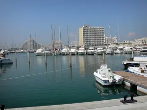 La Grande-Motte - Sailing port with its boats and its sailboats, and buildings of the seaside resort 