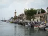 Le Grau-du-Roi - Fishing port, fishing boats moored to the quay, houses and Grau-du-Roi lighthouse