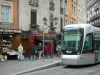 Grenoble - Tram, shops, lamppost and walls of the old town