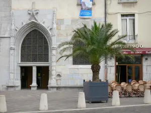 Grenoble - Portal of the Notre-Dame cathedral, palm tree and café terrace