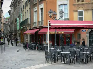 Grenoble - Café terrace of the Place Sainte-Claire square and facade of houses in the old town