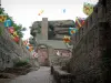 Haut-Barr castle - Entrance to the fortress decorated with shield flags