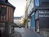 Honfleur - Narrow street leading to the Sainte-Catherine square, Sainte-Catherine church, houses and shops