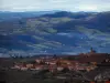 Landscapes - Houses of a village in in the Pierres Dorées (golden stones) area, and hills