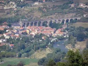 Landscapes of Aveyron - Tarn valley: view of the church bell tower, the roofs of the village, and the Aguessac viaduct