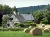 Landscapes of the Eure - Half-timbered house, trees and haystacks in a field