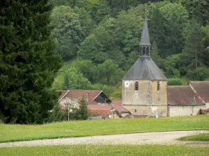 Landscapes of the Haute-Marne - Bell tower of the Saint-Pierre-ès-Liens church and roofs of houses in the village of Cirey-sur-Blaise surrounded by greenery, in the Blaise valley
