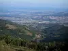 Landscapes of Loire - Hills of the Pilat mountain area in foreground with view of the Rhône plain