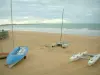 Landscapes of the Loire-Atlantique coast - Sandy beach with boats, sea (Atlantic Ocean) and turbulent sky