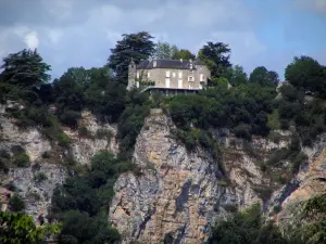 Landscapes of the Quercy - Perched residence, trees, cliffs and cloudy sky