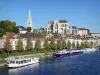 Landscapes of the Yonne - Auxerre: Saint-Germain abbey, houses along the Yonne river and boats moored at the Quai de la Marine