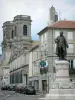 Langres - Statue of Denis Diderot (artwork by Frederic Bartholdi), towers of the Saint-Mammès cathedral and houses in the old town