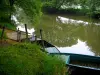 Lavardin - Boats moored to the bank and the Loir River