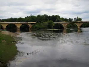 Limeuil - Bank, confluence of the Dordogne and the Vézère rivers, bridges, trees and cloudy sky, in Périgord