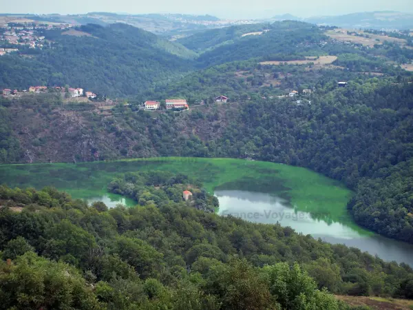 Loire gorges - Grangent lake (water reservoir on the Loire River), trees along the water, hills, forests and houses