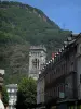 Luchon - Church bell tower, facades of houses in the spa town and mountain dominating the set