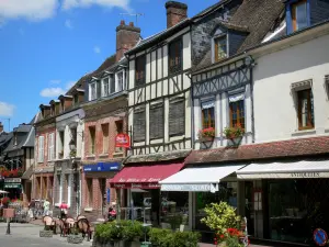 Lyons-la-Forêt - Facades of houses, café terrace and shops of the village