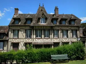 Lyons-la-Forêt - Half-timbered facade of the house of Maurice Ravel, bench in foreground