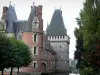 Maintenon castle - Renaissance-style castle and its square keep, trees along the water