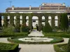 Marmande - Water basin and pristine beds in the French-style formal garden of the cloister of the Notre-Dame church