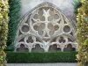 Marmande - Gothic tracery in the French-style formal garden of the cloister of the Notre-Dame church