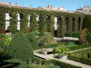 Marmande - Pristine beds in the French-style formal garden of the cloister of the Notre-Dame church