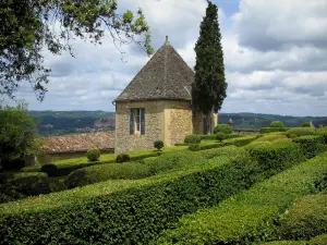 Marqueyssac gardens - Hand-clipped box trees and clouds in the sky, in the Dordogne valley, in Périgord