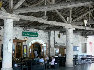 Mauvezin - Café terrace under the covered market hall 
