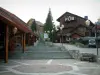 Méribel - Square in the ski resort (winter sports) with stair and wooden residences - chalets