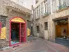 Millau - Facades of houses and shops in the old town