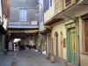 Mirepoix - Medieval bastide town: facades of houses and streets leading to the central square (place des couverts)