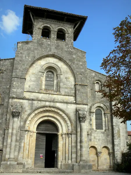 Moirax church - Old Cluniac priory: bell tower, facade and gates of the Notre-Dame Romanesque church