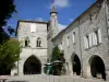Monflanquin - Medieval bastide town: houses of the Place des Arcades square, among which the home of the Prince Noir (Black Prince), and bell tower of Saint-André church