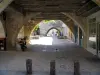 Monpazier - Under the arches, in Périgord