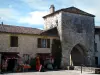 Monpazier - Fortified gate, houses and shop in the fortified town, in Périgord