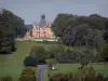 Montmort-Lucy - Castle, trees, meadows and road