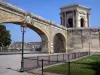 Montpellier - Saint-Clément aqueduct, water reservoir of the Peyrou promenade, lampposts and lawn