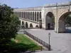 Montpellier - Saint-Clément aqueduct, lawn, lampposts and tree