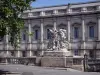 Montpellier - Statue on the Peyrou promenade and facade of the Palais de Justice (law courts)