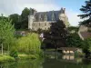 Montrésor - Renaissance château, trees, houses of the village, washhouse and the River Indrois