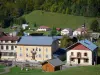 Monts Jura resort - Winter and summer sports resort (ski resort): Mijoux village: houses and church surrounded by meadows; in the Upper Jura Regional Nature Park (Jura mountain range) 