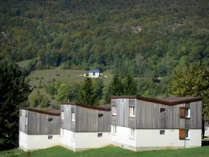 Monts Jura resort - Winter and summer sports resort (ski resort): forest overlooking the houses of Lélex; in the Upper Jura Regional Nature Park (Jura mountain range) 