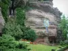 Mount Sainte-Odile - Pink sandstone cliff, a ceramic station of the way of the Cross, plants, flowers and a tree