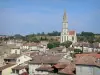 Nérac - Église Notre-Dame, arbres et toits de maisons de la cité médiévale