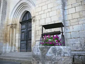 Nouaillé-Maupertuis abbey - Saint-Junien abbey (ancient Benedictine abbey): portal of the abbey church and flower-bedecked well